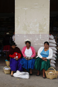 Portrait of people sitting in basket