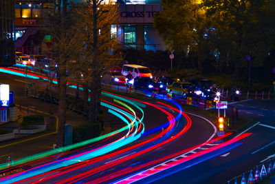 High angle view of light trails on road at night