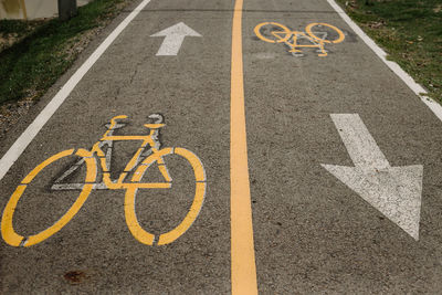 High angle view of bicycle sign on road