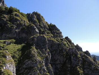 Low angle view of rocks against sky