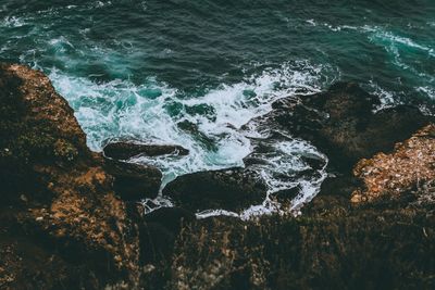 High angle view of rocks in sea