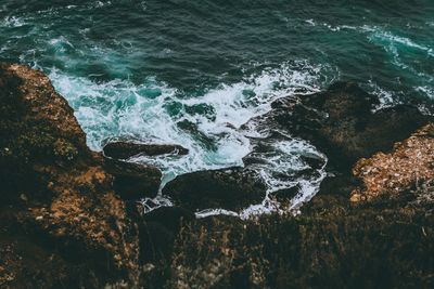 High angle view of rocks in sea