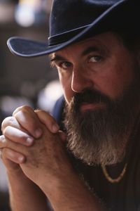 Close-up portrait of man wearing hat