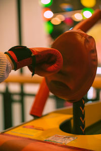 Cropped hand of man holding dumbbell