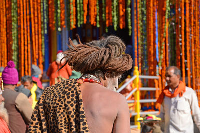 Rear view of people enjoying at market