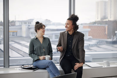 Business people having coffee break in office