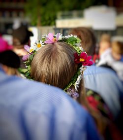 Rear view of woman with flowers