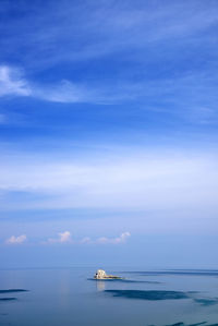 Distant view of olkhon island against blue sky