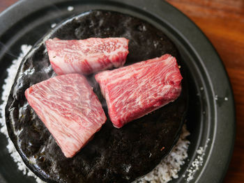 High angle view of meat on barbecue grill
