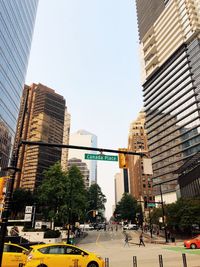 City street and modern buildings against sky