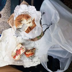 Directly above shot of sandwiches with plastic bag on bench