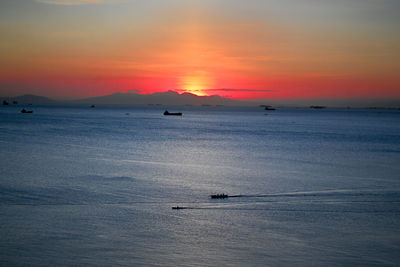 Scenic view of sea against orange sky