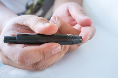 Close-up of person holding camera