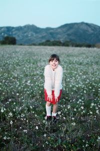 Girl standing on field