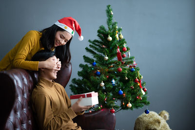 Young woman with christmas tree