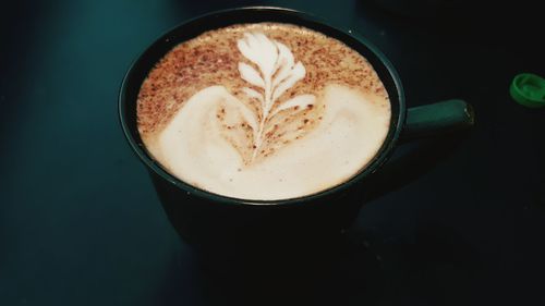 High angle view of cappuccino on table