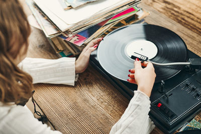 Listening to music from vinyl record. playing music. retro music party. vintage style. analog media