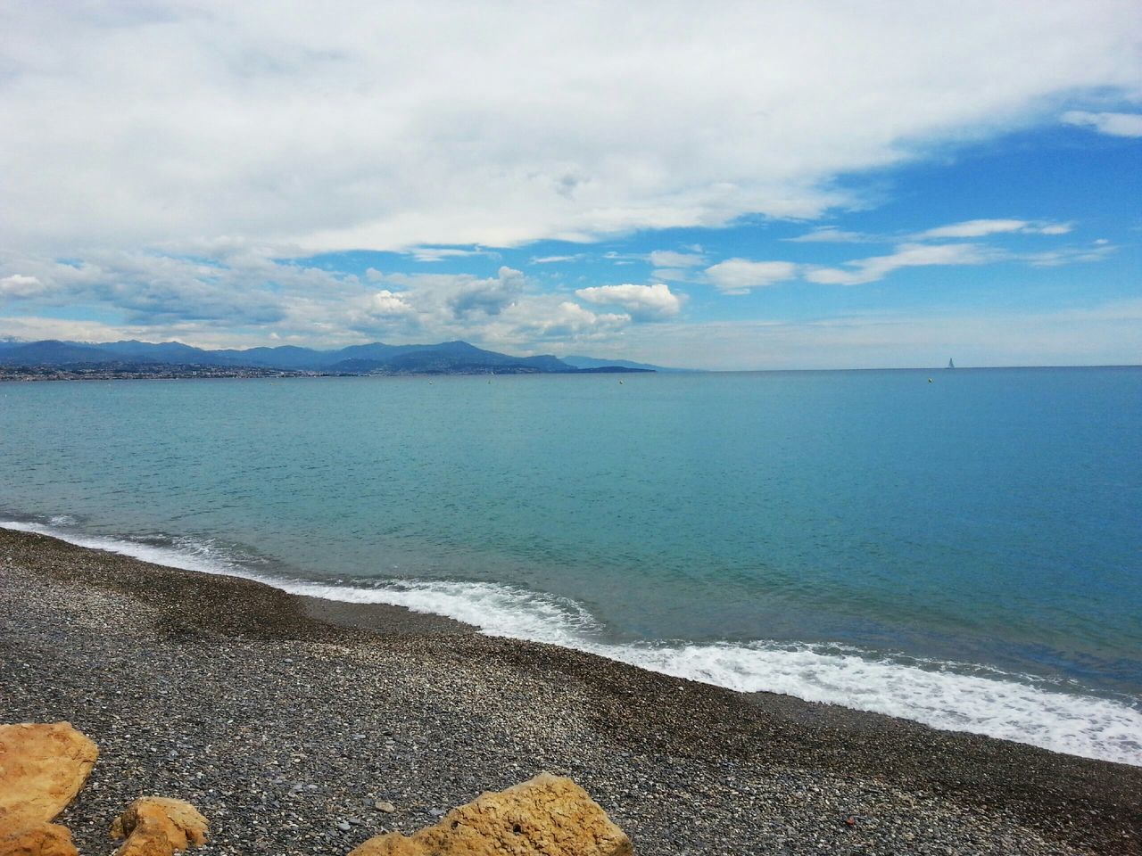 sea, water, sky, tranquil scene, beach, scenics, tranquility, beauty in nature, shore, horizon over water, cloud - sky, nature, idyllic, sand, cloud, coastline, cloudy, calm, remote, outdoors