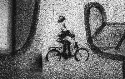 Shadow of graffiti on wall