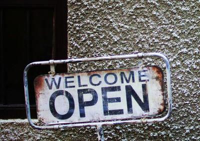 Close-up of information sign on snow