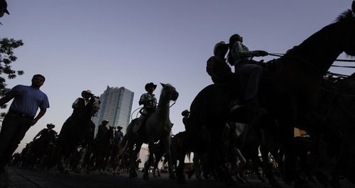 People at town square against clear sky