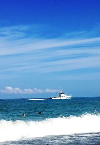 Boat sailing in sea against sky