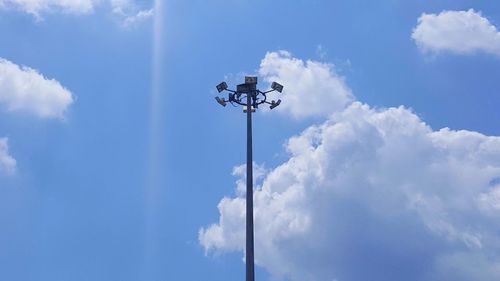 Low angle view of floodlight against sky