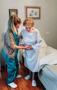 Nurse caring senior patient in hospital