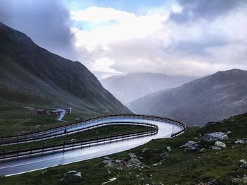 High angle view of road by mountain against sky