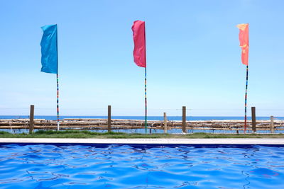 Scenic view of swimming pool against clear blue sky