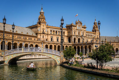 View of bridge over river in city