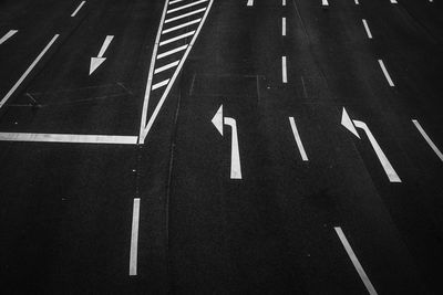 High angle view of arrow sign on road