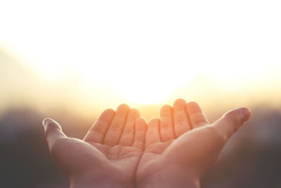 Cropped image of hand against white background