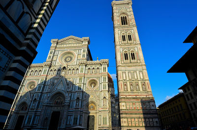 Low angle view of building against blue sky