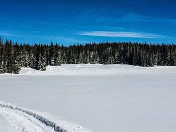 Scenic view of snow covered landscape against sky