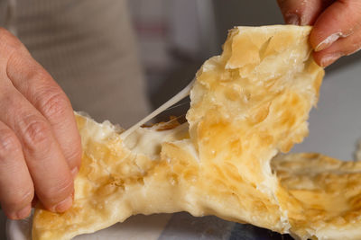 Close-up of man eating food in plate