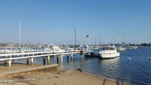 Boats moored in sea