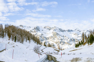 Scenic view of snow covered mountains against sky