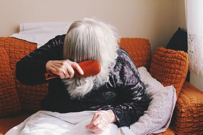 Woman sitting in hands