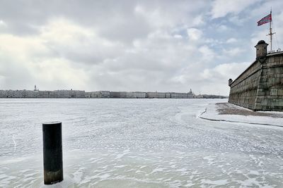 Scenic view of frozen lake against sky