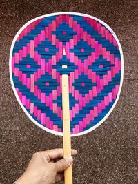 Directly above shot of person holding hand fan