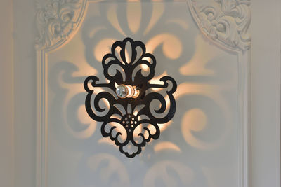 Close-up of illuminated lamp at home