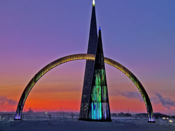 View of illuminated building against blue sky