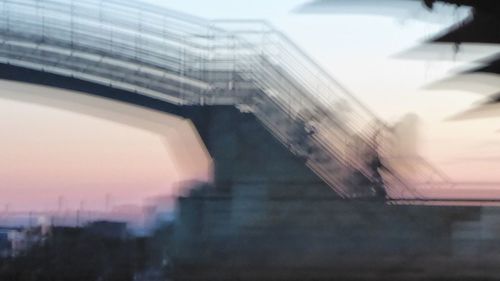 Low angle view of bridge against sky in city