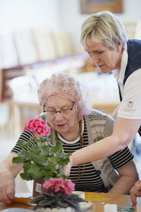 Nurse with senior woman in care home