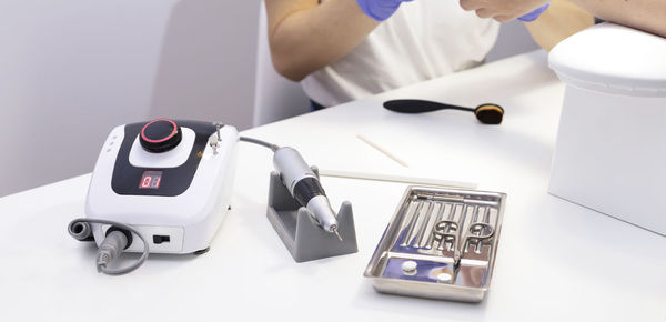 Cropped hand of person working on table
