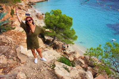  summer tourist destination of cala saladeta sea and wild nature and trees and clear water in ibiza