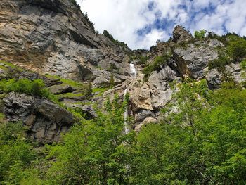 Low angle view of rocks against sky