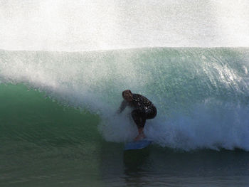 Full length of man surfing