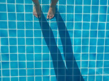 Low section of person at poolside